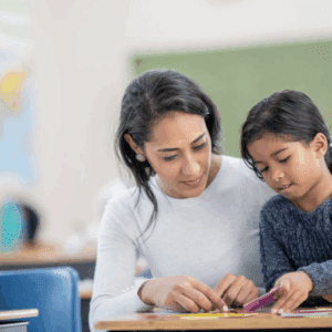 Experienced IBT working directly with a child to apply behavior intervention techniques taught through IBT training and applied behavior analysis programs.